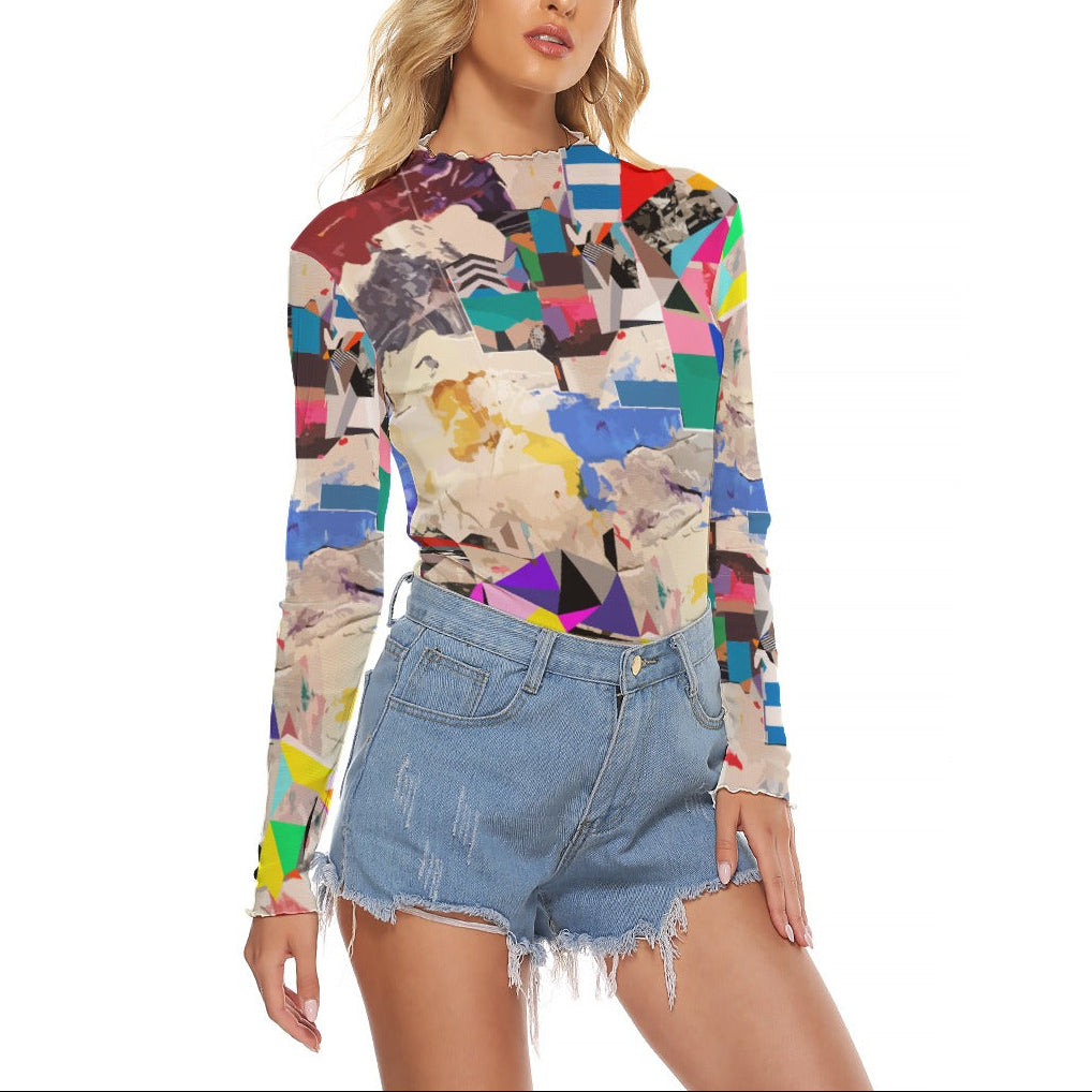 Woman wearing a colorful patterned top and denim shorts on a white background