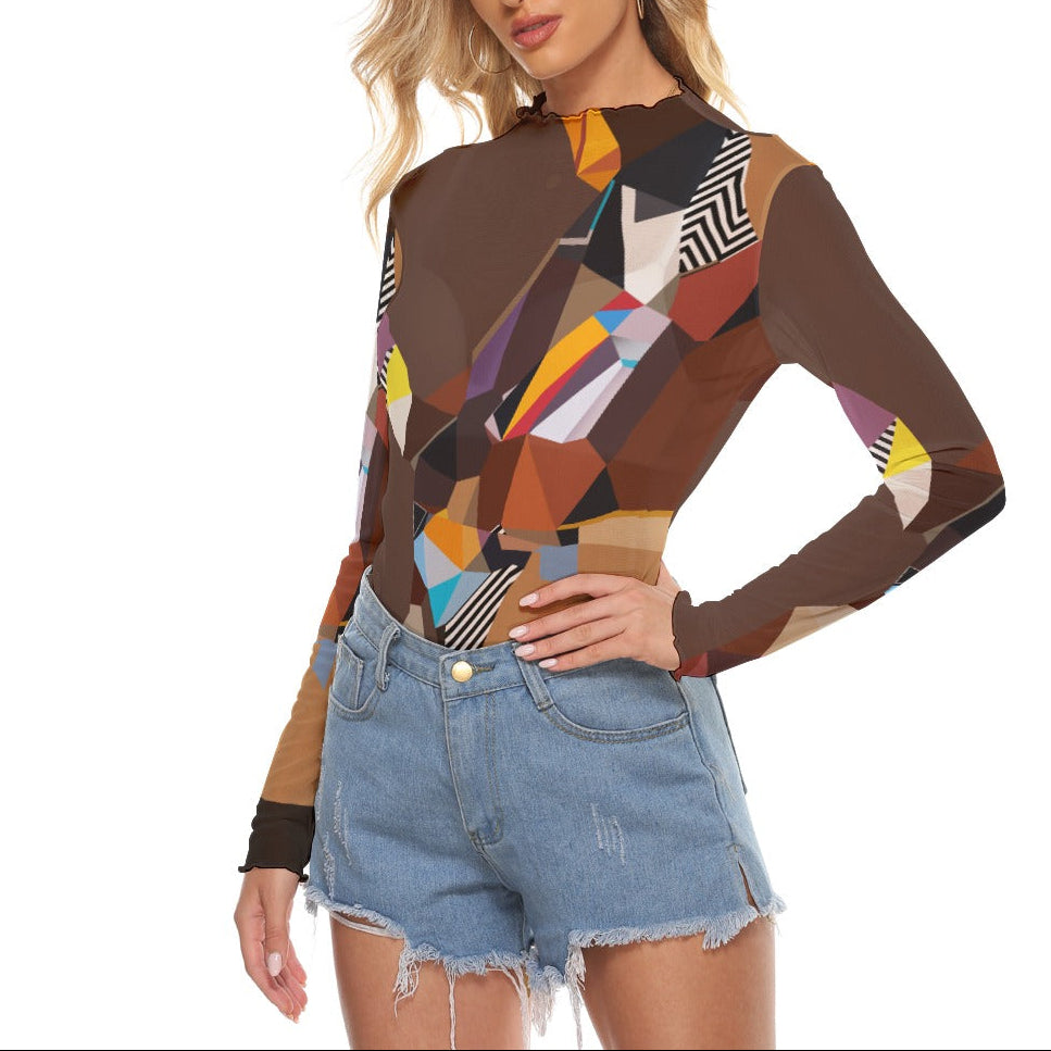 Woman wearing a colorful geometric-patterned top and denim shorts on a white background