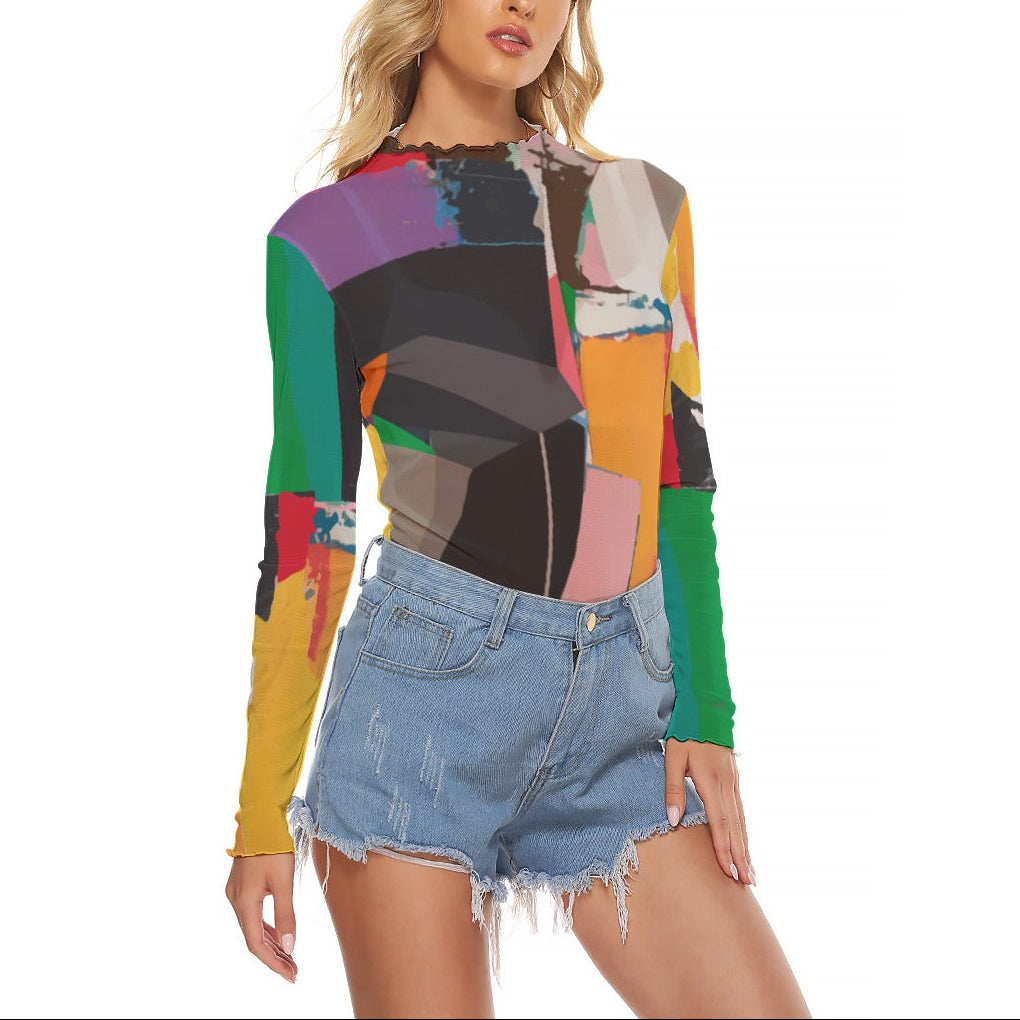 Woman wearing a colorful geometric-patterned top and denim shorts on a white background