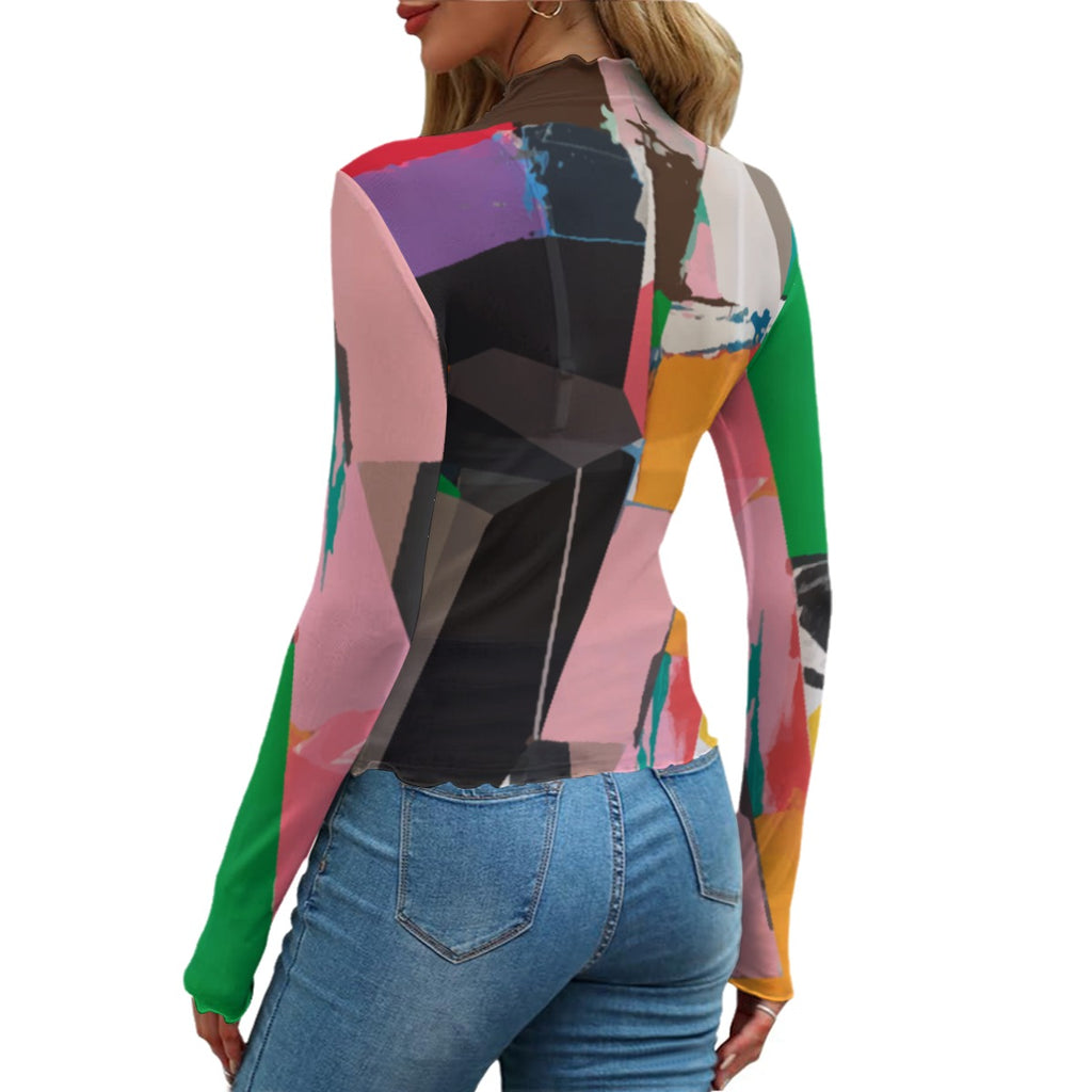 Colorful geometric-patterned top worn by a person on a white background