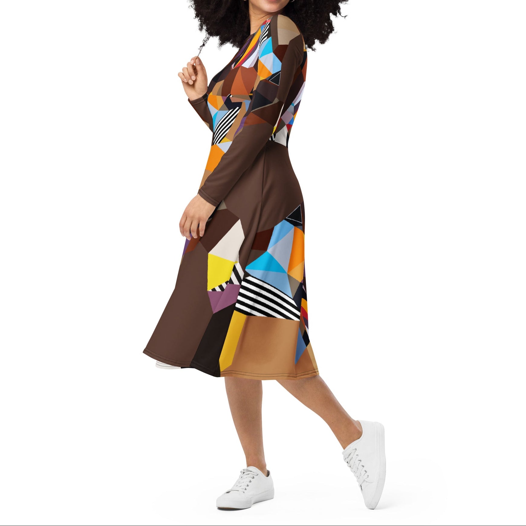 Side view of a brown geometric artistic midi dress with long sleeves, functional pockets, and flowy skirt, contemporary statement dress for women