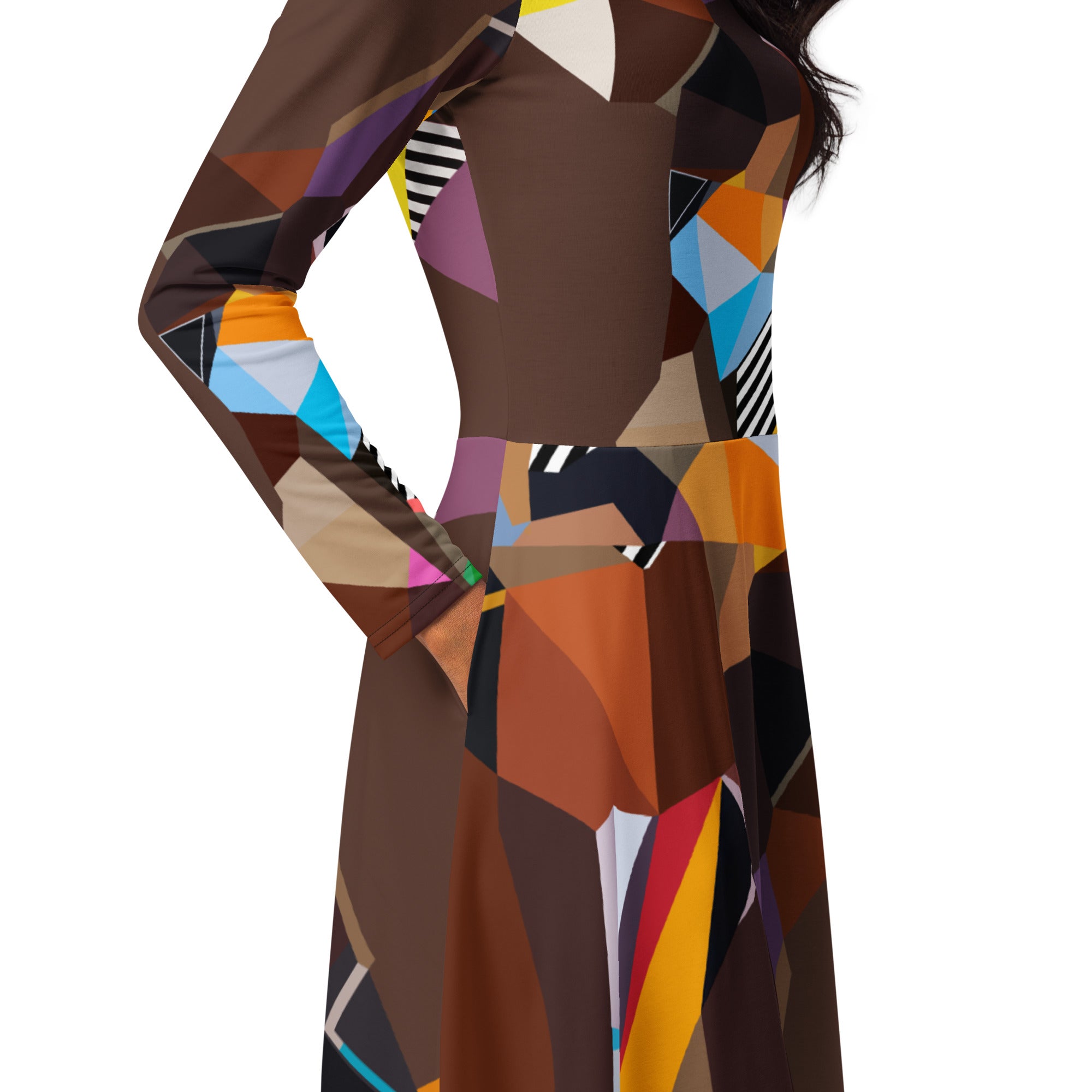 Close-up detail of geometric pattern and fabric on a brown artistic midi dress with long sleeves and pockets