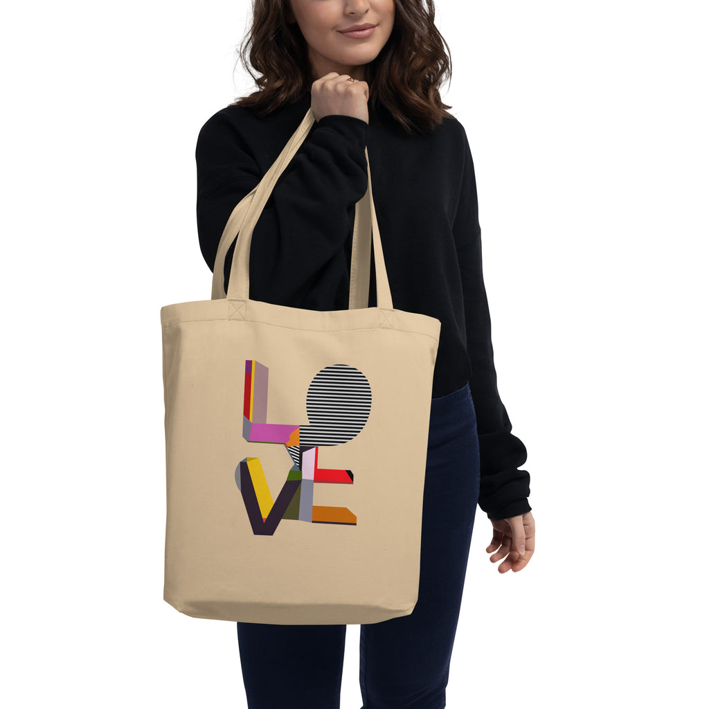 Woman wearing eco friendly organic cotton LOVE tote bag over the shoulder